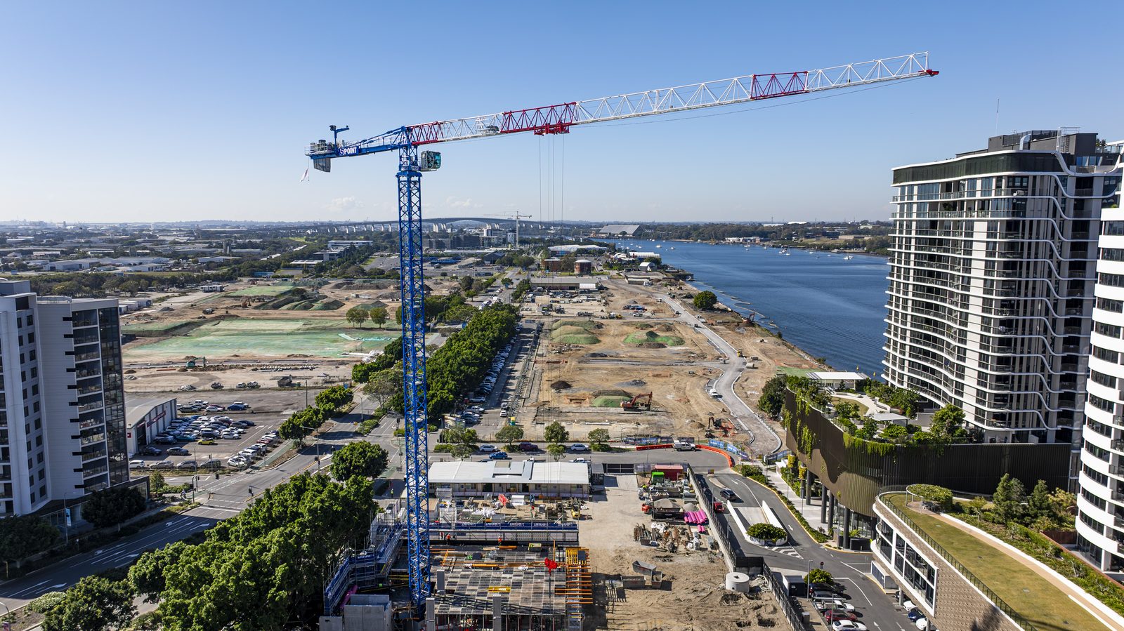 Flat-top tower crane on a waterfront building site