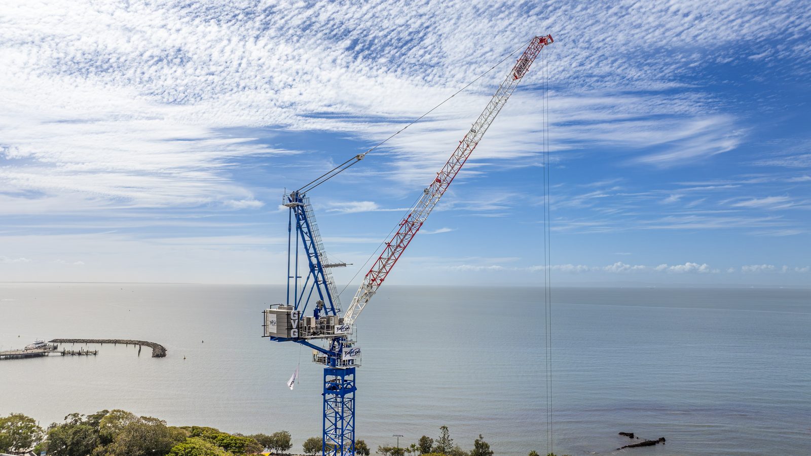 Luffing jib tower crane on the water's edge