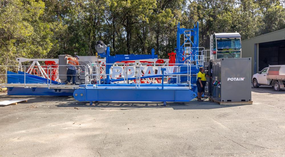 Two TES technicians commissioning a Potain power unit at our QLD Depot